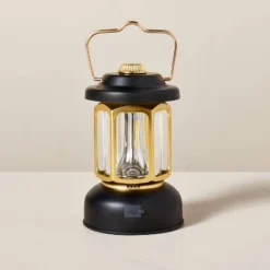 LED Lantern Black/Gold - Hearth & Hand™ With Magnolia 8 LED Lantern Black/Gold - Hearth & Hand™ With Magnolia -Selected Home Furnishings Store GUEST b6e0871e cb05 4956 a6b1 d628b3c5808e